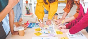 ux vs ui design Young Asian business creative team work together, mobile application software design project. Brainstorm meeting, internet technology, smartphone web app designer, office coworker teamwork concept